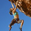 Four questions to help you stay the course as a freelancer Female climber clinging to the edge.
